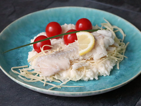 Wolfsbarsch auf Risotto mit Tomaten und Käse