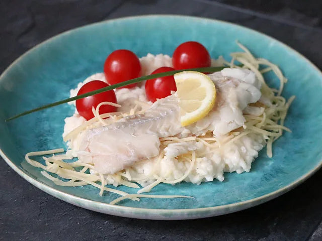 Wolfsbarsch auf Risotto mit Tomaten und Käse
